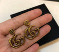Gold Interlocking Stud Earrings